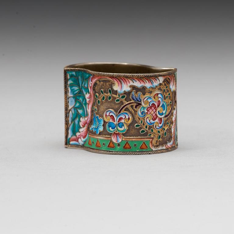 A Russian 20th century silver-gilt and enamelnapkin-ring, marks of the 11th Artel, Moscow 1908-1917.