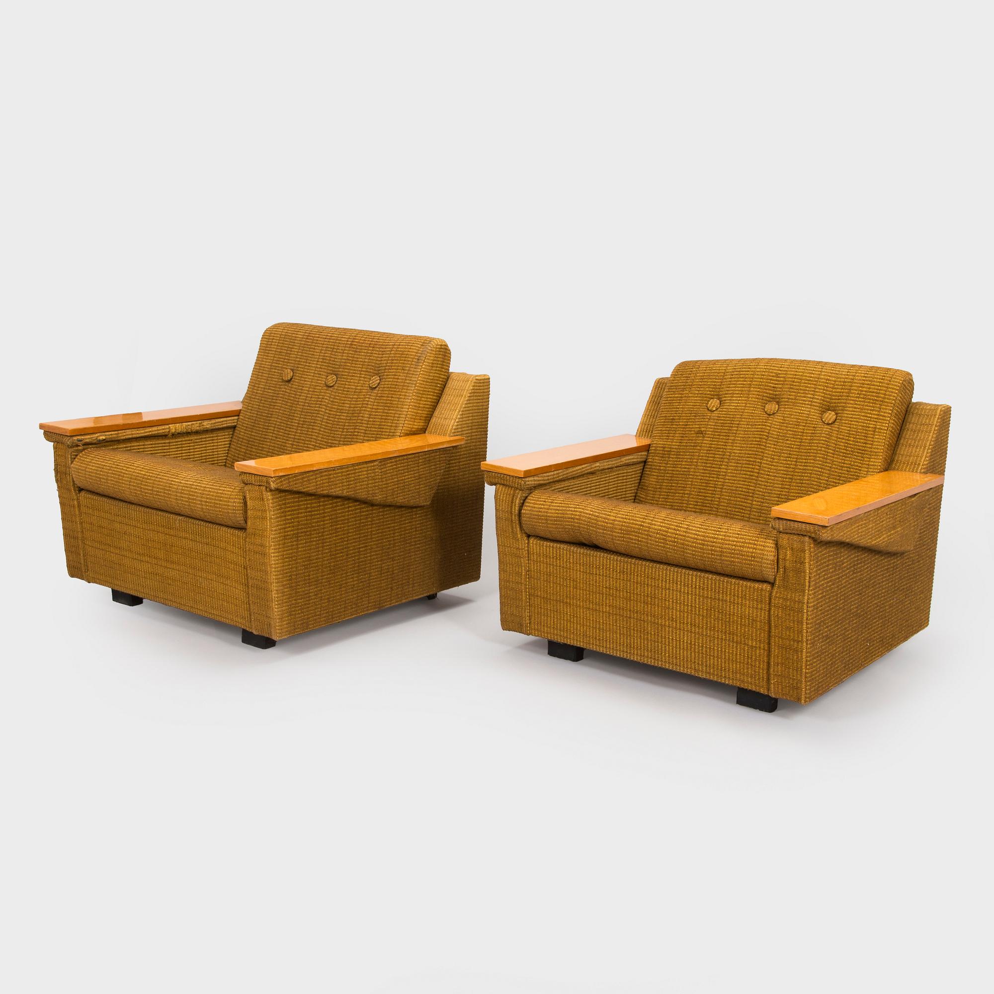 A pair of 1970s armchairs.