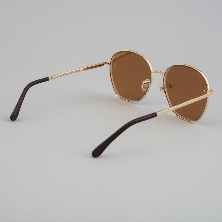 Sunglasses by Chanel.