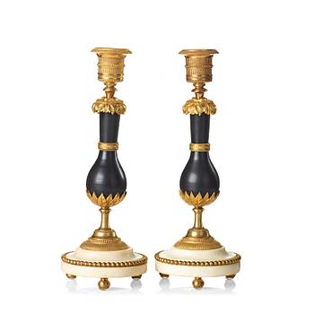 70. A pair of Louis XVI late 18th century candlesticks.