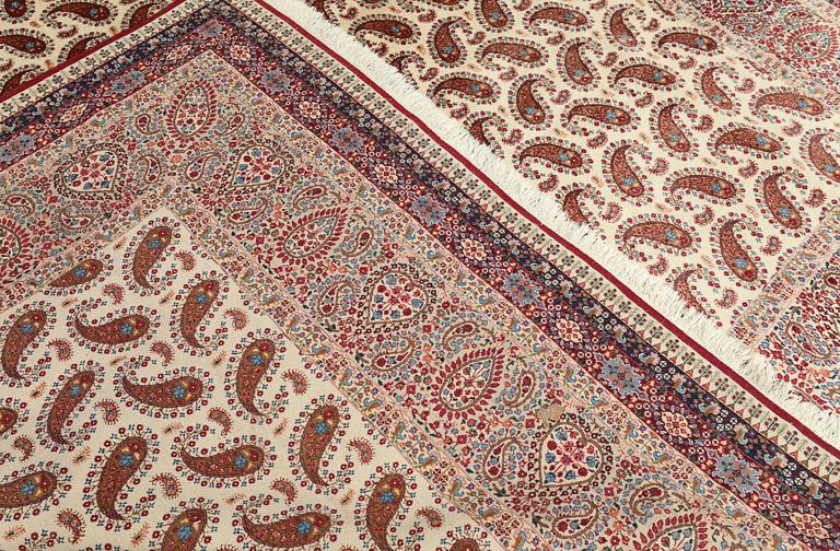 A Kirman carpet, signed, c. 390 x 295 cm.