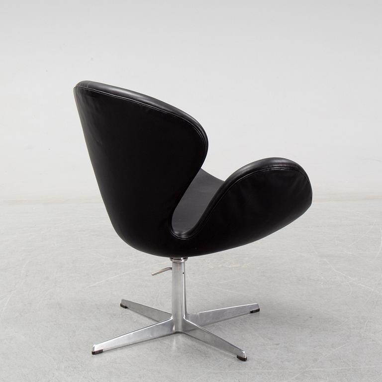 Arne Jacobsen, a black leather 'Swan' chair, Fritz Hansen, Denmark, 1967.