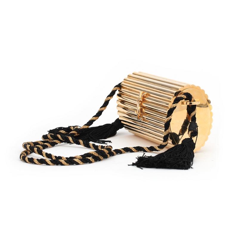 YVES SAINT LAURENT, a golden metal evening bag.