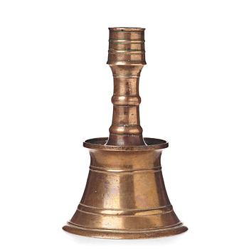 287. A CANDLESTICK, bronze/copper alloy, Ottoman, Turkey 16th-17th century, height 24 cm, the foot diameter 15,5 cm.