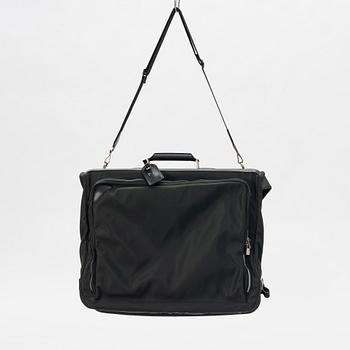 Louis Vuitton, a green canvas and Taiga garment bag.
