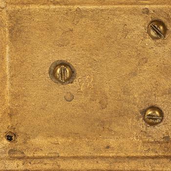 A pair of brass candleholders, 20th century.