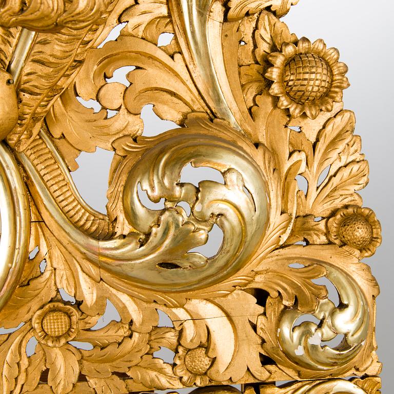 A MIRROR, Baroque style, circa 1900, gilt wood.