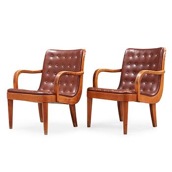 531. A pair of Swedish Modern birch and brown leather armchairs, probably by Axel Larsson, Bodafors, 1930's.