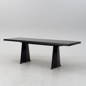 A 'Trapeze' dinner table by Jean Prouvé, Vitra, 2002.