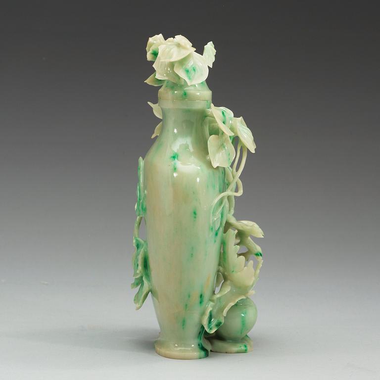 A Chinese elaborately carved nephrite vase with cover, 20th Century.