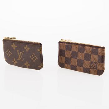 LOUIS VUITTON, Two 'Pochette Clés' key pouches, one in Monogram and the other one in Damier Ebene canvas.