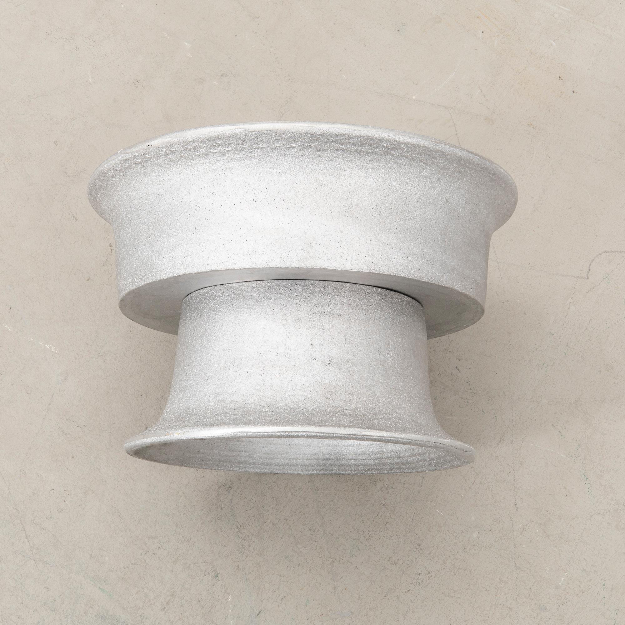 Signe Persson-Melin, ytterfoder Byarums bruk gjuten aluminium.