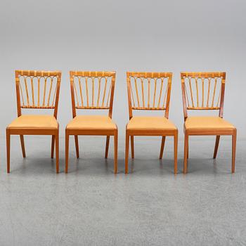 A set of four of Josef Frank mahogany and rattan dining chairs, Svenskt Tenn, Stockholm, Sweden.