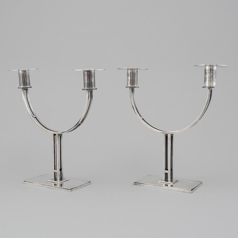 A pair of Klas-Göran Tinbäck two light sterling silver candelabra. Stockholm, 1989.