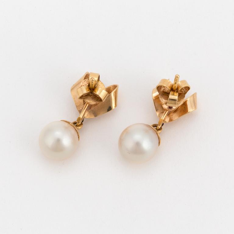A pair of earrings set with cultured pearls.