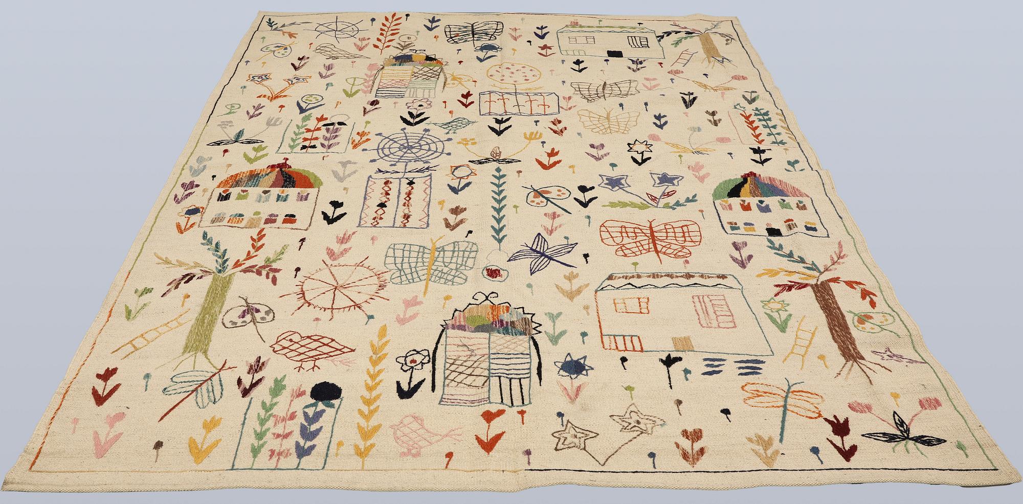 A hand-embroidered Kilim rug, approx. 243 x 178 cm.