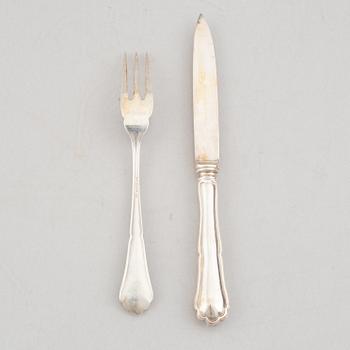 A set of 24 silver fruit knives and forks by Hanna Persson, Kristianstad, Sweden, 1923.