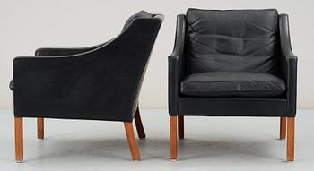 A pair of black leather Børge Mogensen armchairs, Fredericia, Denmark.