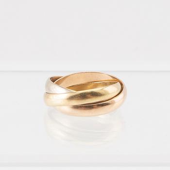 An 18K tri-coloured "Trinity" gold ring by Cartier.