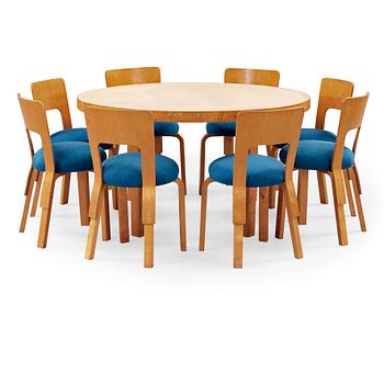 82. An Alvar Aalto birch dining table and eight chairs, Artek, Finland 1930's-40's.