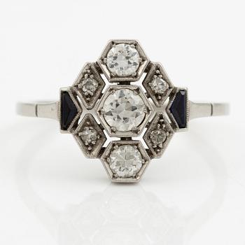 A platinum ring set with round brilliant-cut diamonds and sapphires, Art Déco.