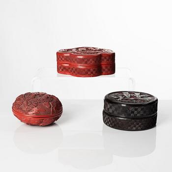 A group of three Chinese lacquer boxes with covers, late Qing dynasty.