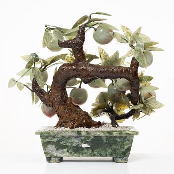 A stone table decoration in the shape of a peach tree, China, 20th century.