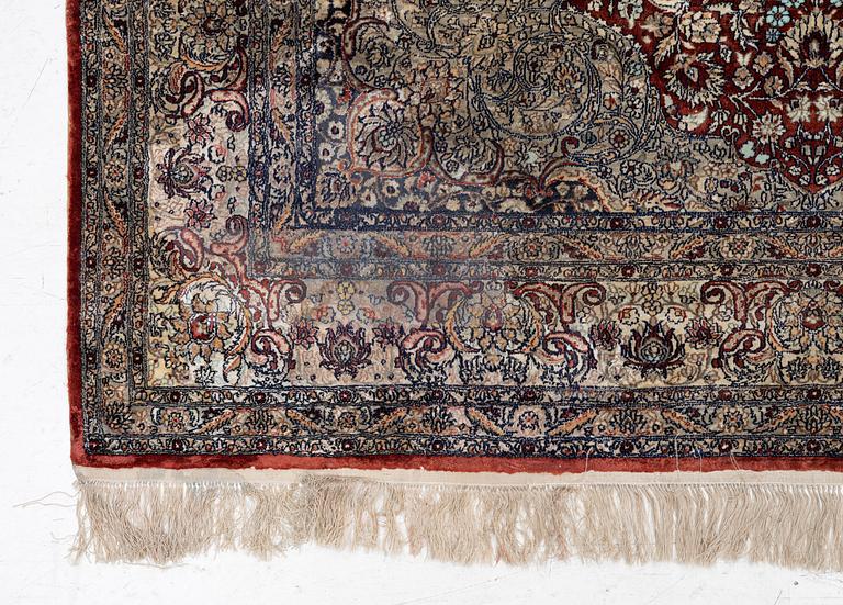 Carpet, part silk, approx. 240 x 158 cm.