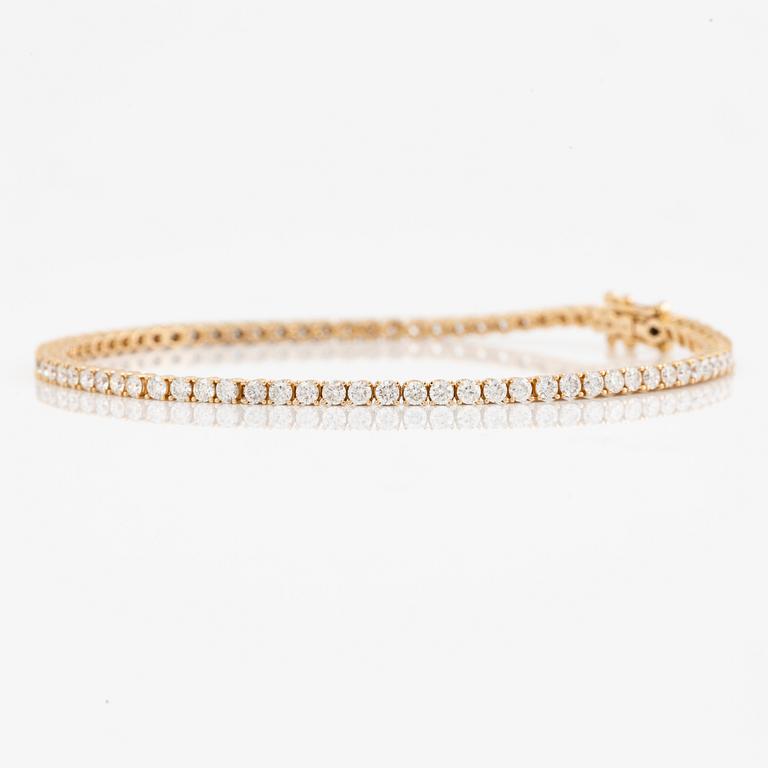 Tennisarmband 18K guld med briljantslipade diamanter.