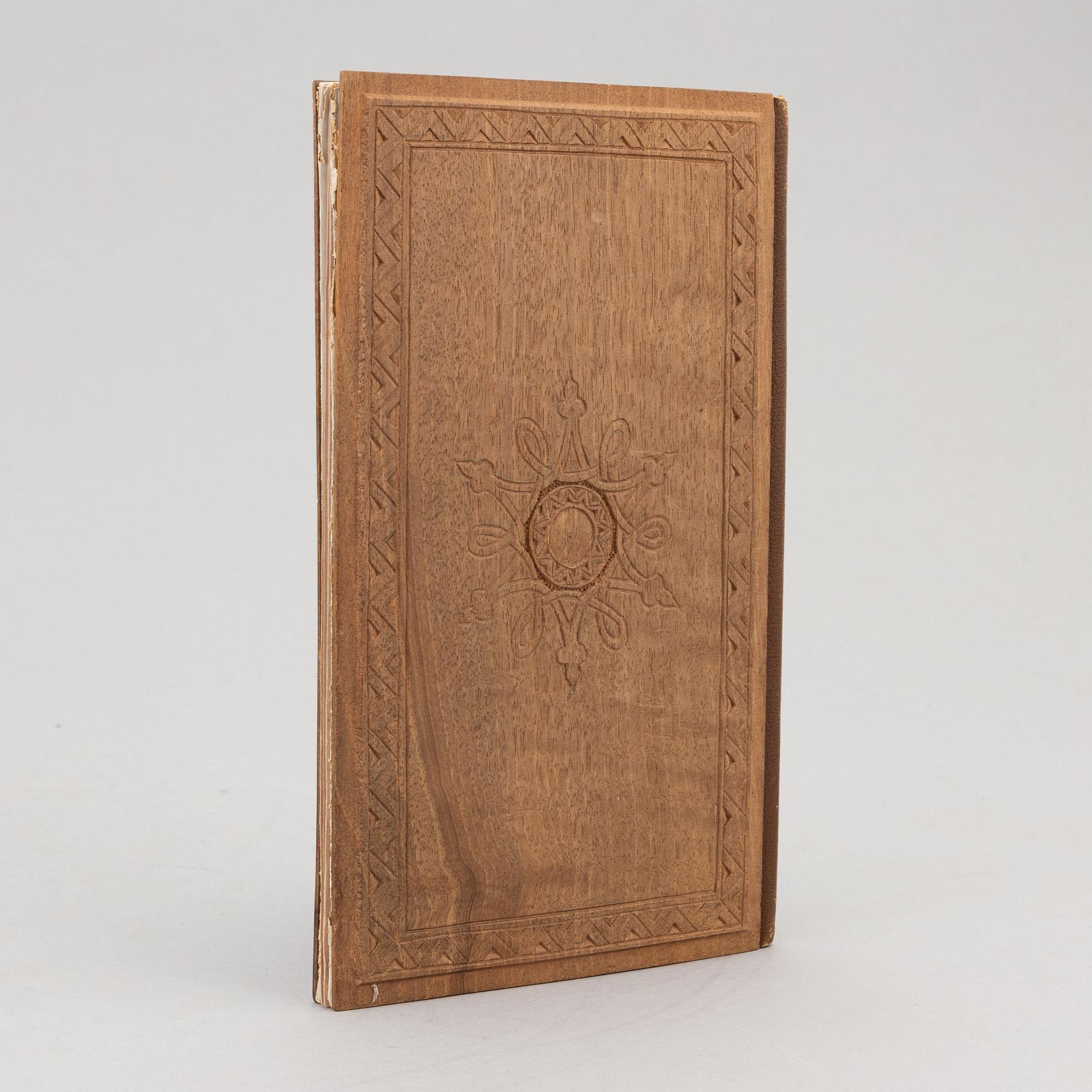 A keepsake book embellished by Ellen Jolin featuring a 'Santa Claus' figure.