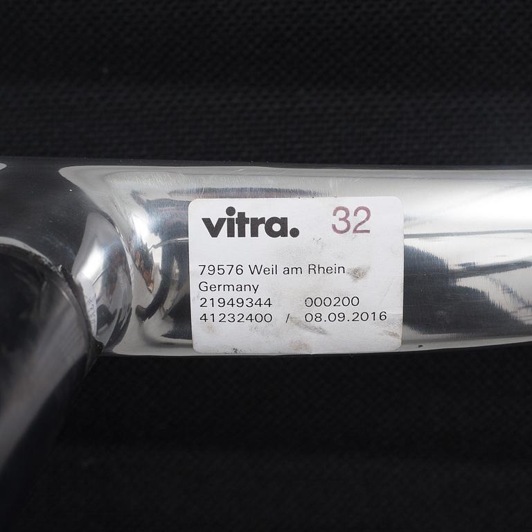 A 'EA 104 Swivel' armchair by Charles & Ray Eames, Vitra, 2016.