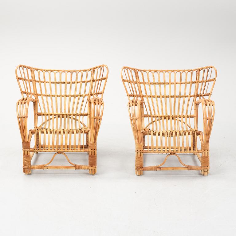 A pair of rattan easy chairs, possibly Viggo Boesen.