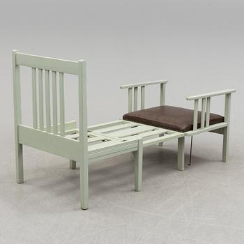 An early 20th century chair/children's bed.