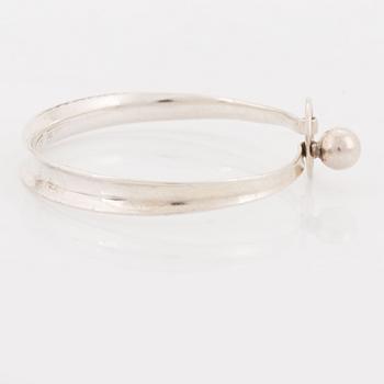 A silver Erik Granit bracelet.