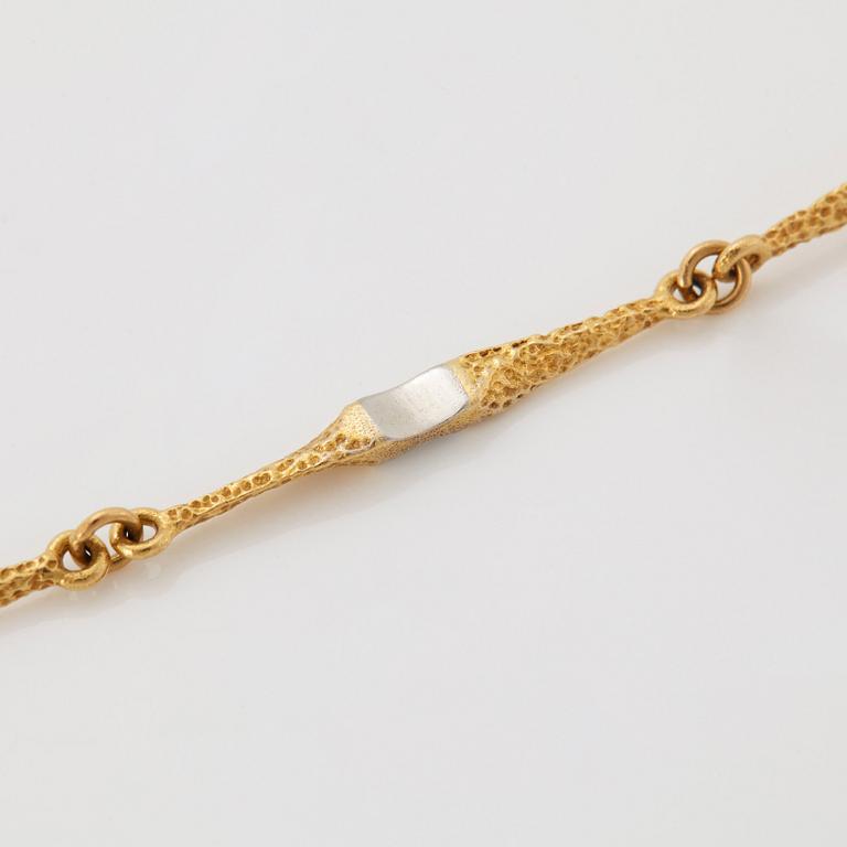 A Lapponia necklace in 18K gold and platinum.