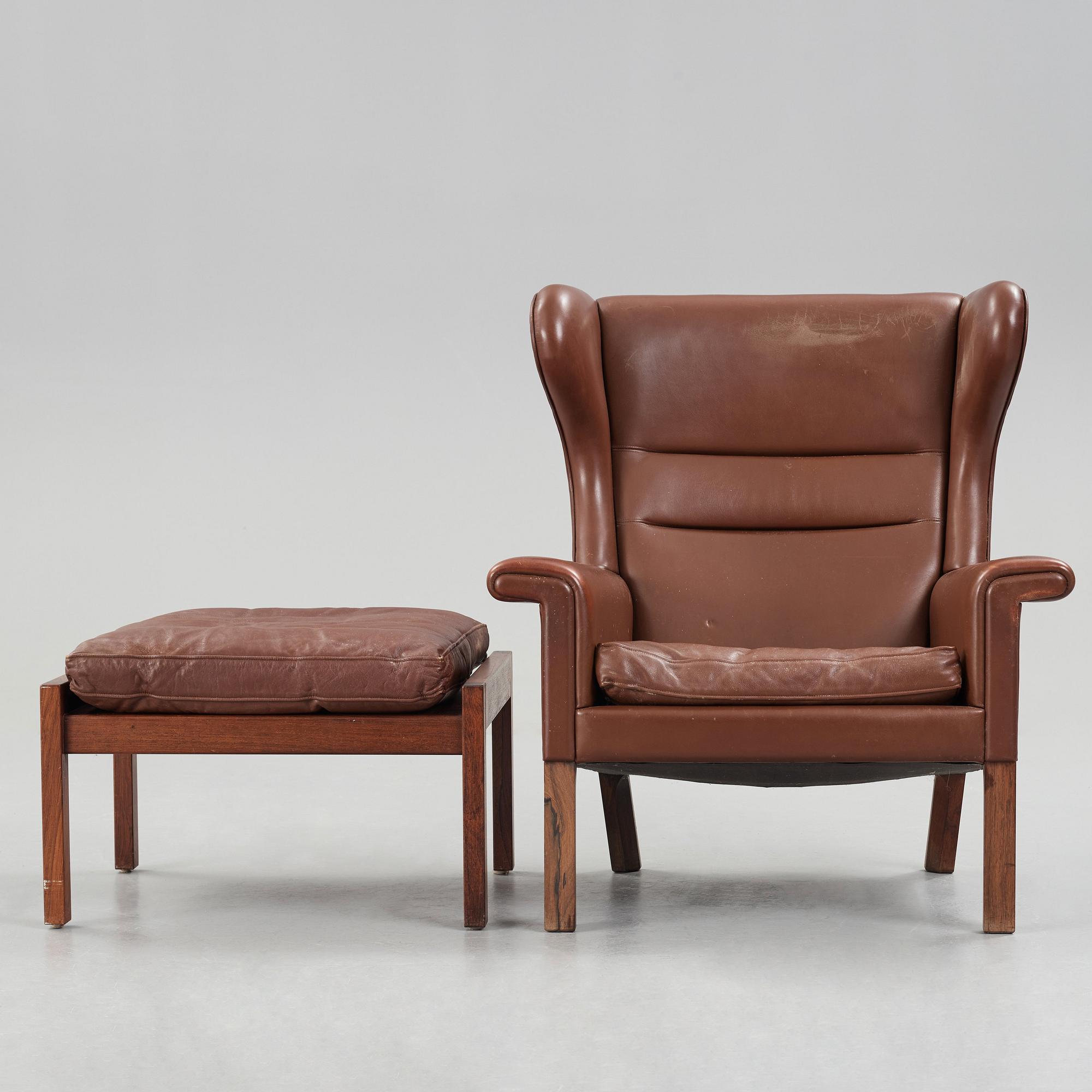 Hans J. Wegner, a pair of "AP-65" easy chairs with stools, AP-stolen, Denmark 1960's.