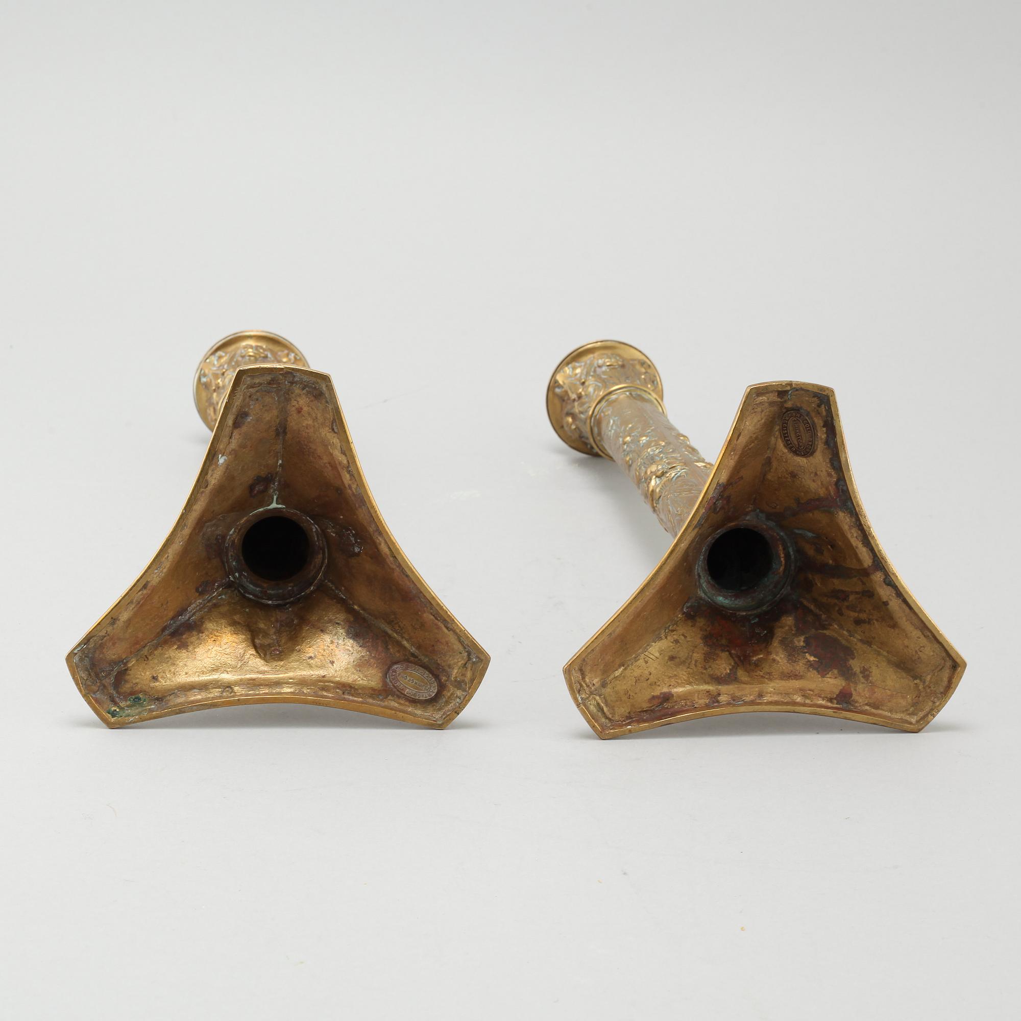 A pair of brass candlesticks from Elkingtons in Birmingham, 19th century.