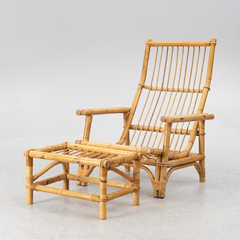 An easy chair with foot stool, end of the 20th century.