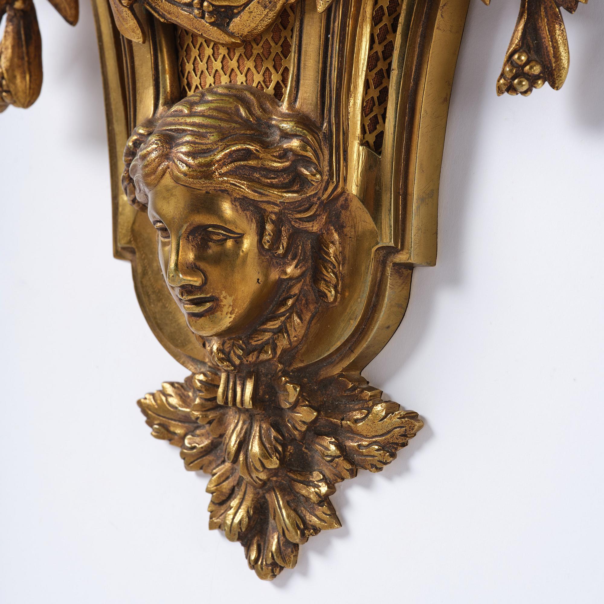 A French  Louis XVI-style wall clock, around 1900.