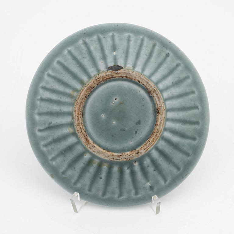 A celadon dish, for the south east asian market, double fish, Mingstyle, 20th Century. And a Chinese sealstone.