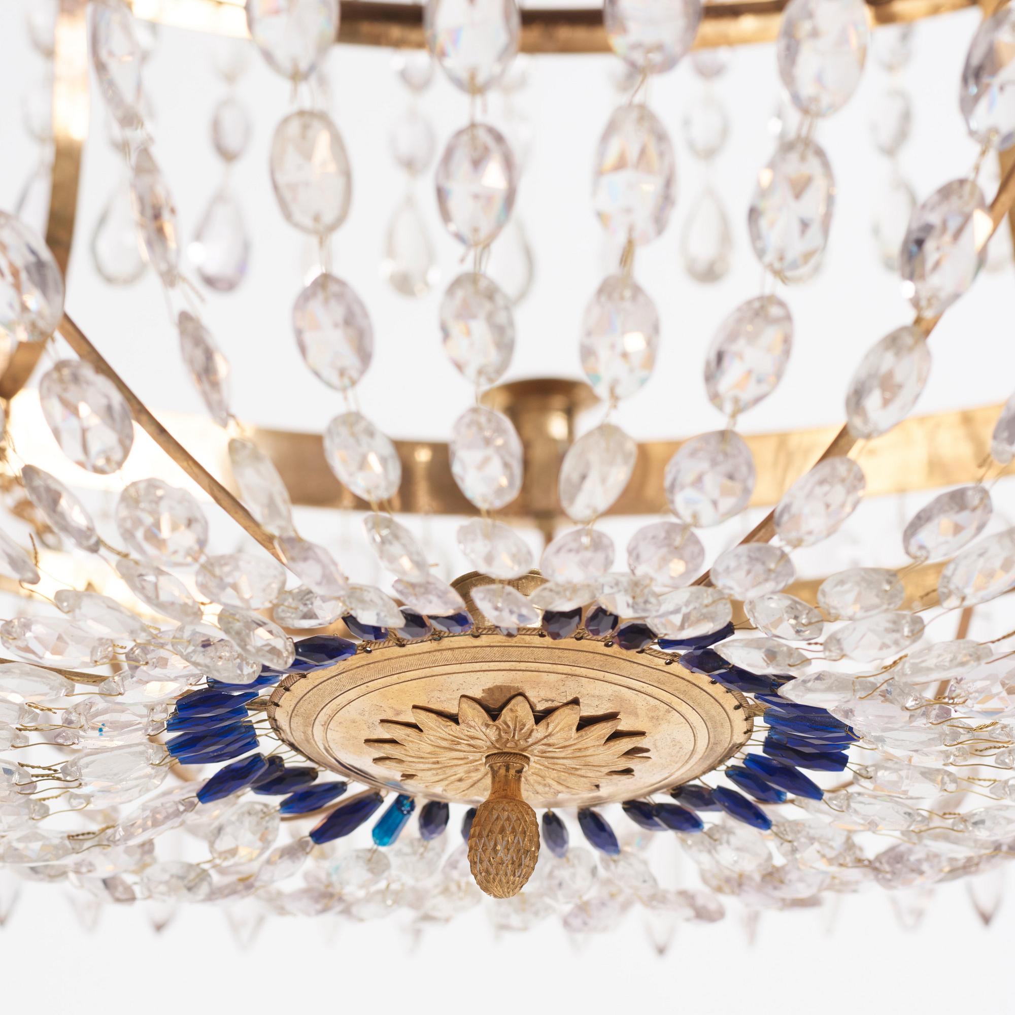 A late Gustavian gilt brass and cut glass thirteen-light chandelier, circa 1800.