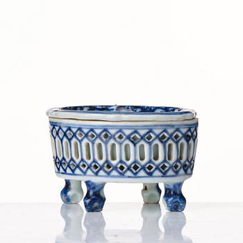 A blue and whtie reticulated salt with liner, Qing dynasty, 18th Century.