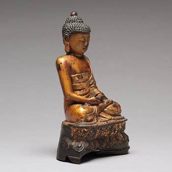 A seated bronze figure of buddha, Ming dynasty (1368-1644).