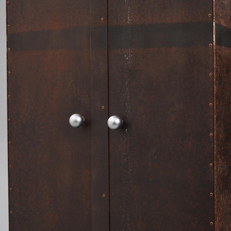 A contemporary patinated metal cabinet.