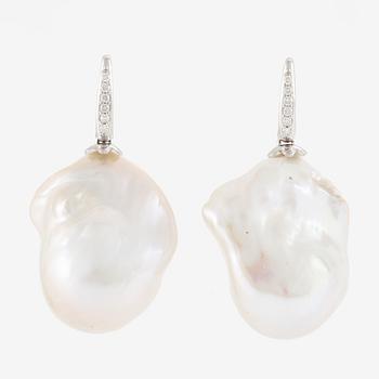 Earrings, a pair, 18K white gold with baroque cultured freshwater pearls and brilliant-cut diamonds.
