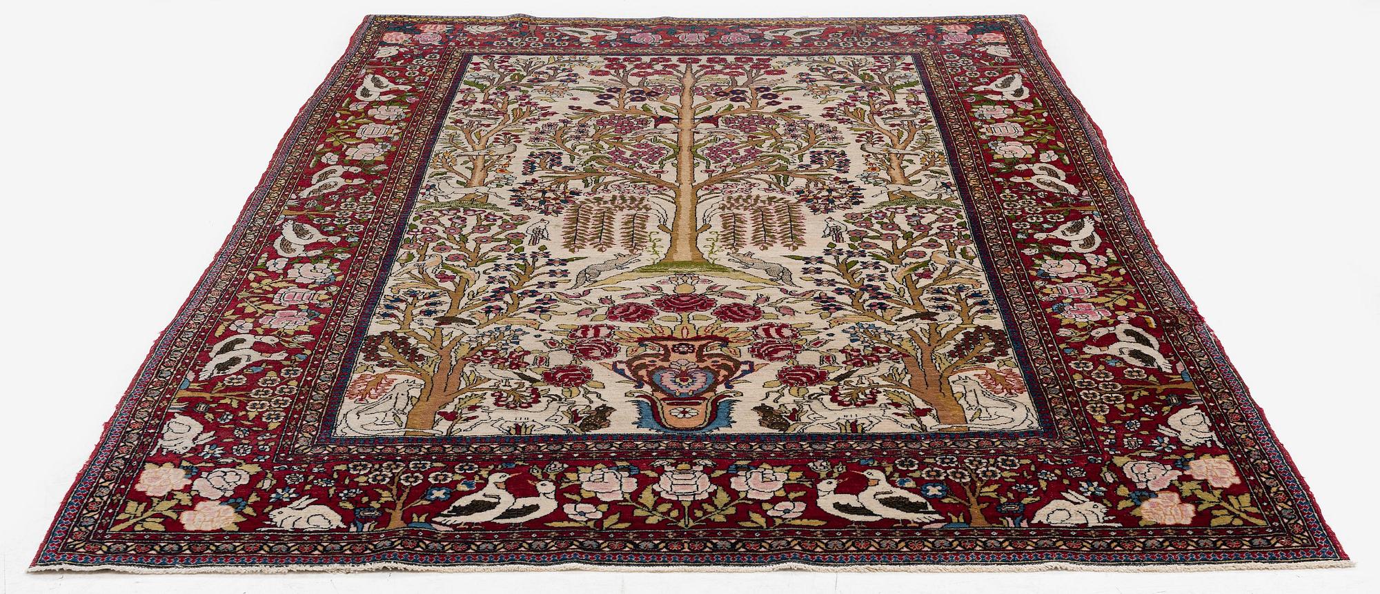 An antique pictoral Esfahan rug, Central Persia (Iran), c 213 x 142 cm.