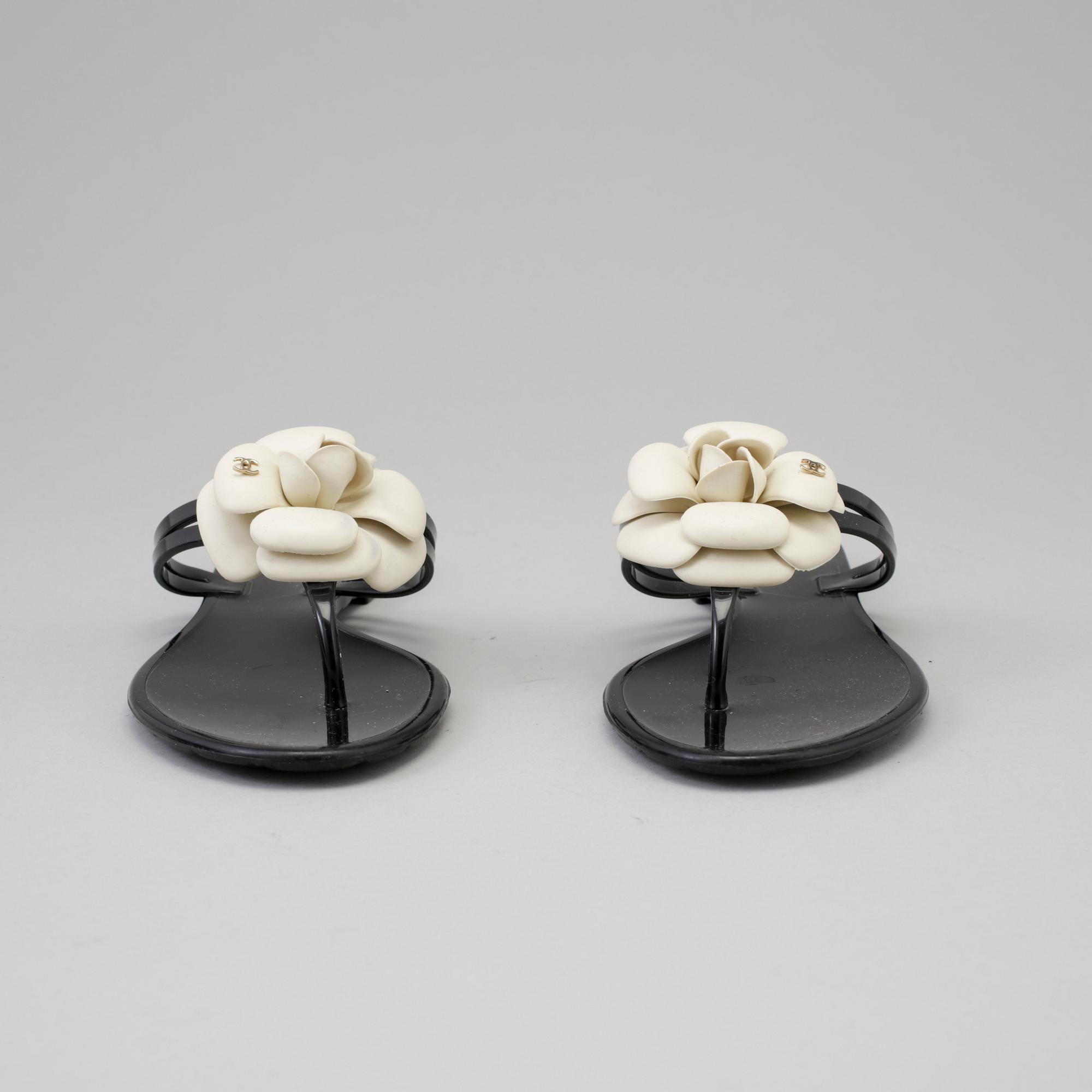 CHANEL, a pair of black plastic sandals. Size 38.