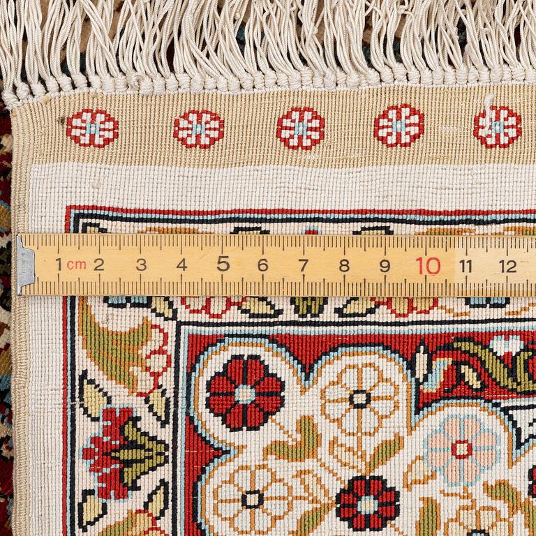 A semi-antique silk Hereke rug, West Anatolia, c. 180 x 121 cm.