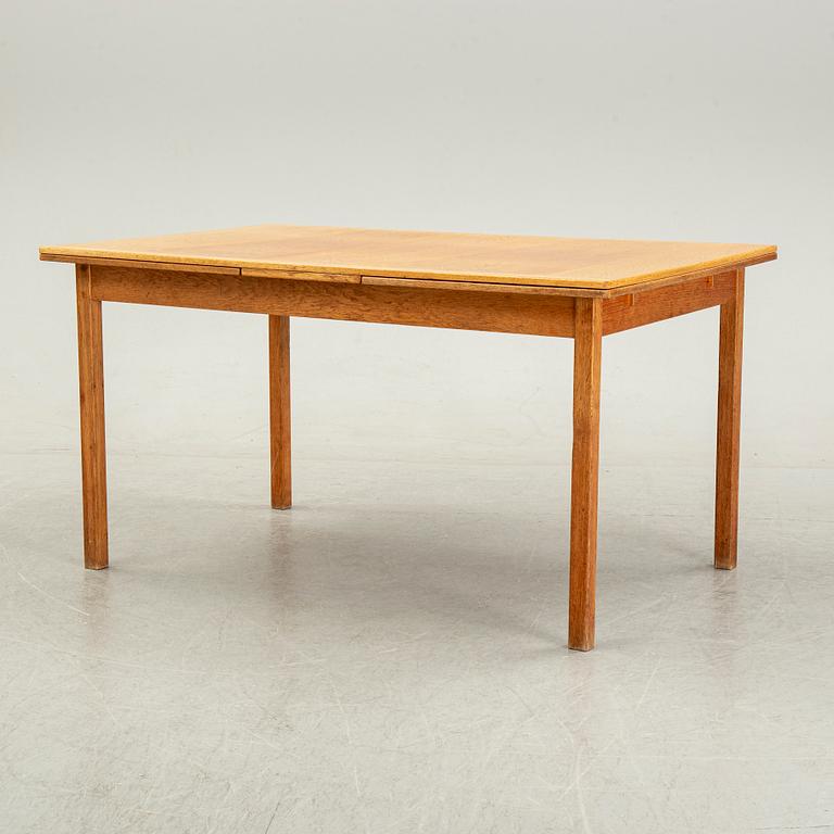 Knud Andersen, a set of six chairs for J.C.A Andersen, Aarhus, Denmark and a dinner table from Troeds, Bjärnum.