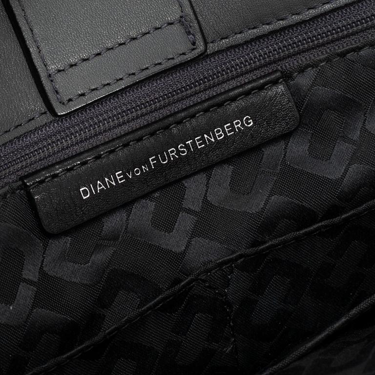 DIANE VON FÜRSTEBERG, a grey leather 'DVF Secret Agent' bag.